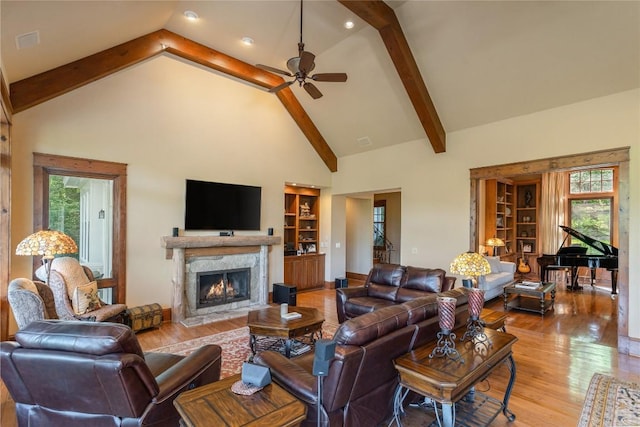 119 Old Still Rd, Sapphire, NC 28774 - living room with plenty of natural light, ceiling fan, high vaulted ceiling, wood finished floors, and a premium fireplace