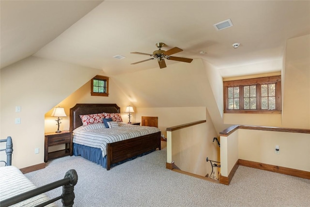 119 Old Still Rd, Sapphire, NC 28774 - carpeted bedroom with multiple windows, vaulted ceiling, and a ceiling fan
