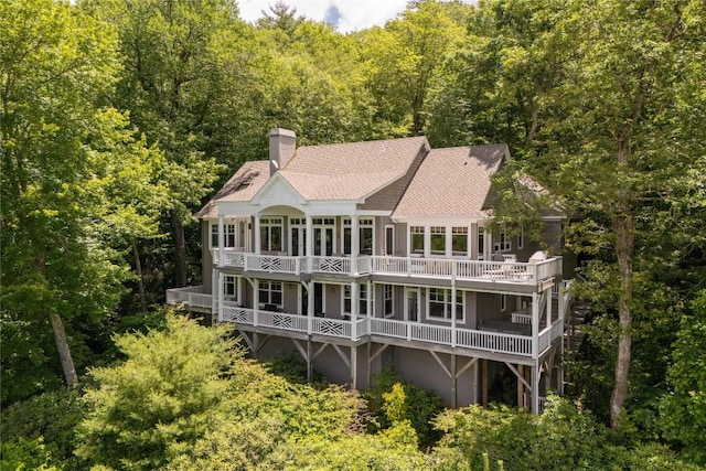119 Old Still Rd, Sapphire, NC 28774 - rear view of property featuring a wooden deck, a shingled roof, a view of trees, and a chimney