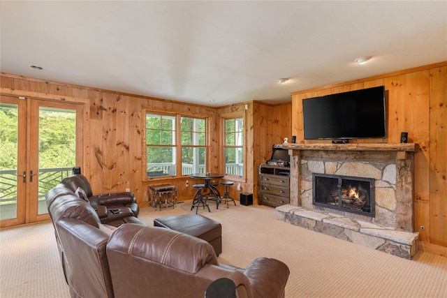 119 Old Still Rd, Sapphire, NC 28774 - carpeted living room with wood walls, a fireplace, plenty of natural light, and french doors