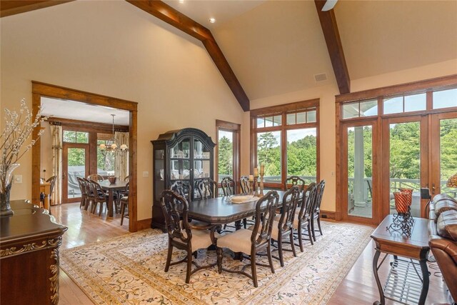 119 Old Still Rd, Sapphire, NC 28774 - dining space featuring high vaulted ceiling, french doors, light wood finished floors, beamed ceiling, and a chandelier