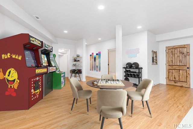 dining space with hardwood / wood-style flooring