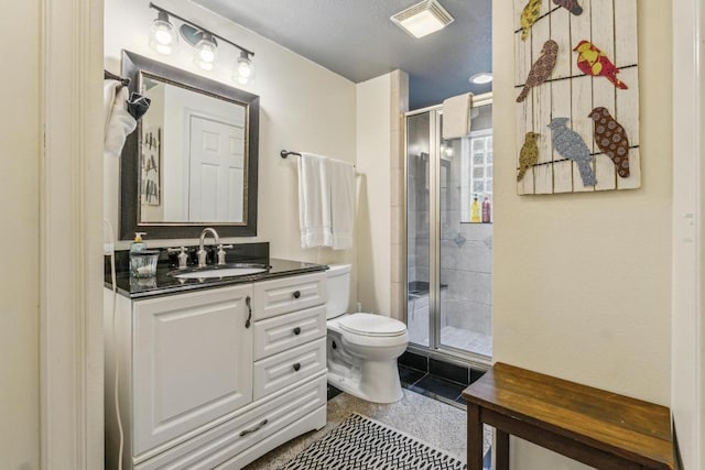 full bath with a shower stall, toilet, and vanity