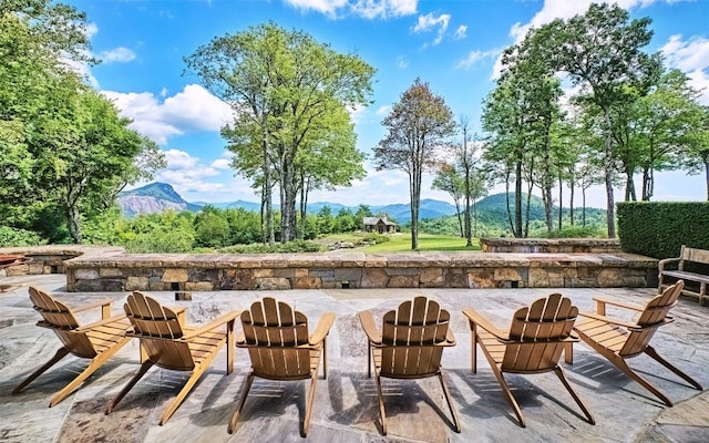 view of patio / terrace featuring a mountain view