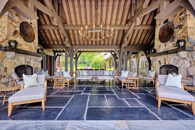 view of patio / terrace with an outdoor living space with a fireplace