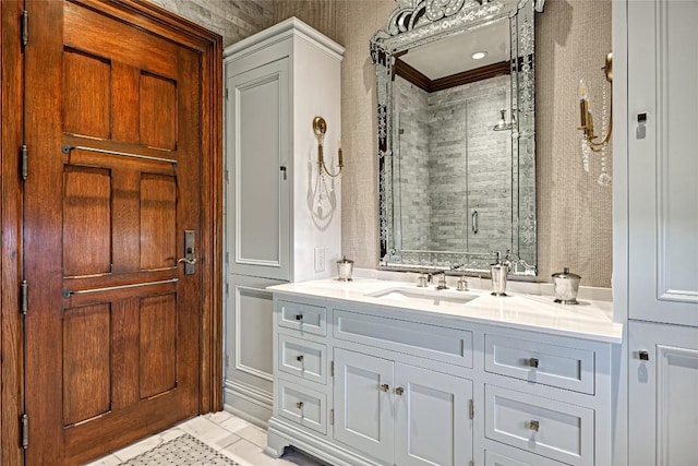 full bath featuring vanity, ornamental molding, and a stall shower