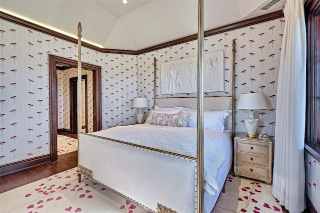 bedroom with wallpapered walls, wood finished floors, and visible vents