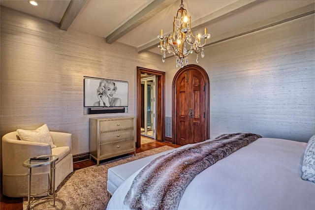bedroom with wood finished floors, recessed lighting, beam ceiling, and a chandelier