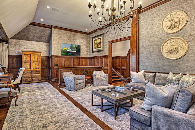 living area with ornamental molding, wainscoting, wood finished floors, recessed lighting, and a notable chandelier