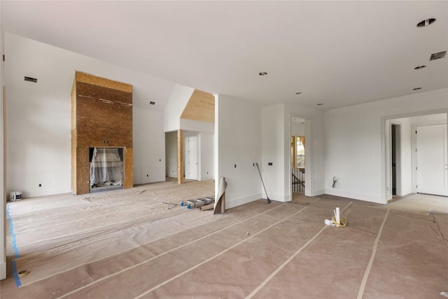 148 E Ridge Rd, Cashiers, NC 28717 - unfurnished living room with a fireplace