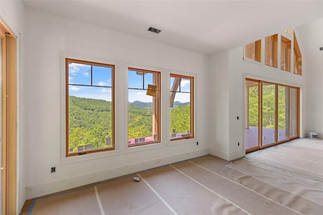 148 E Ridge Rd, Cashiers, NC 28717 - unfurnished room with healthy amount of natural light and baseboards