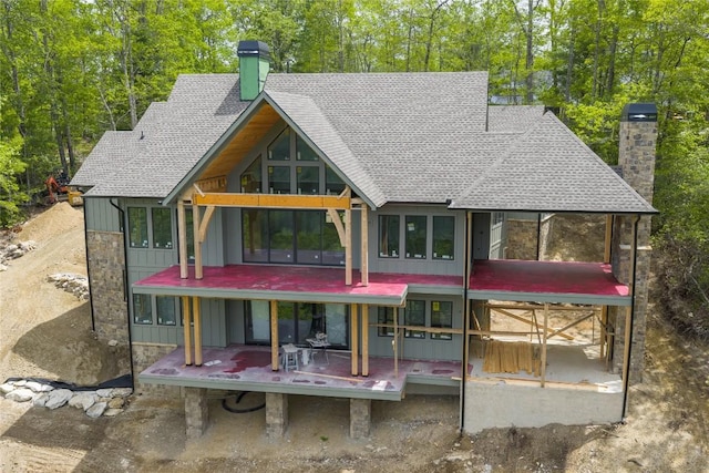 148 E Ridge Rd, Cashiers, NC 28717 - back of house with a chimney, roof with shingles, and board and batten siding