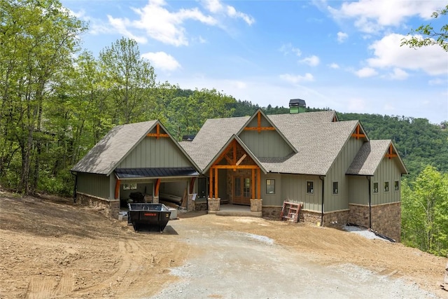 148 E Ridge Rd, Cashiers, NC 28717 - view of front of house with dirt driveway, a shingled roof, and board and batten siding