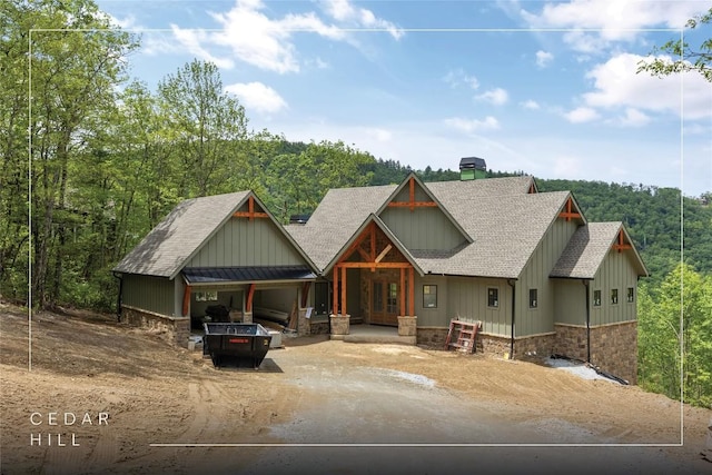 148 E Ridge Rd, Cashiers, NC 28717 - view of front of property with roof with shingles, driveway, board and batten siding, and a chimney