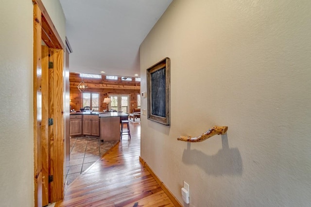 hallway featuring light wood-style flooring