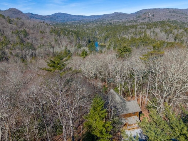 aerial view with a mountain view and a view of trees