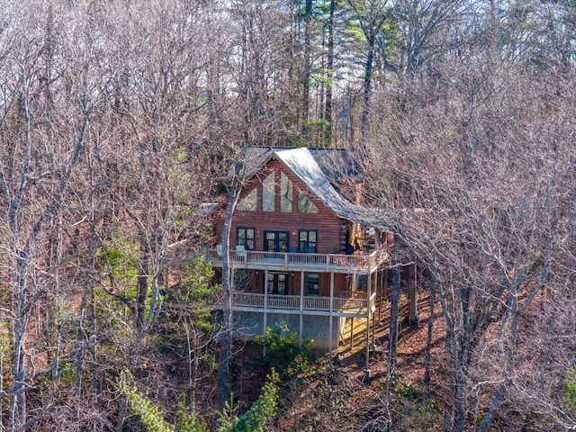 back of property with log exterior