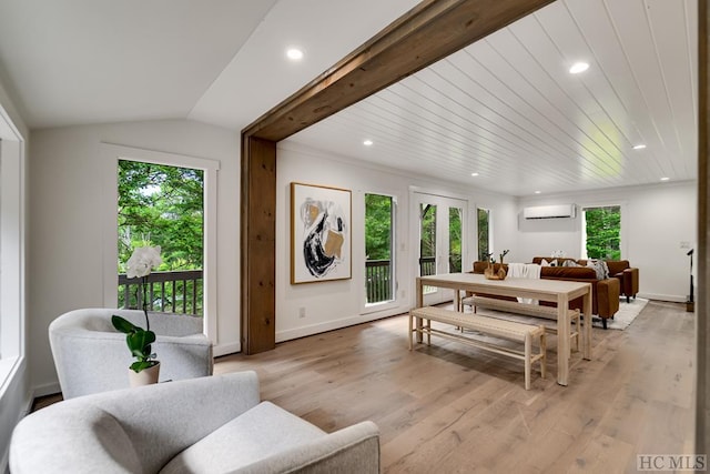 dining room featuring wood ceiling, lofted ceiling with beams, light hardwood / wood-style flooring, and an AC wall unit