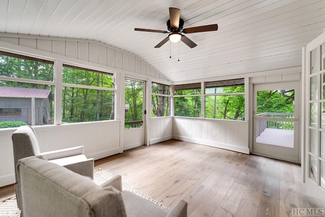 sunroom featuring lofted ceiling, wood ceiling, and ceiling fan