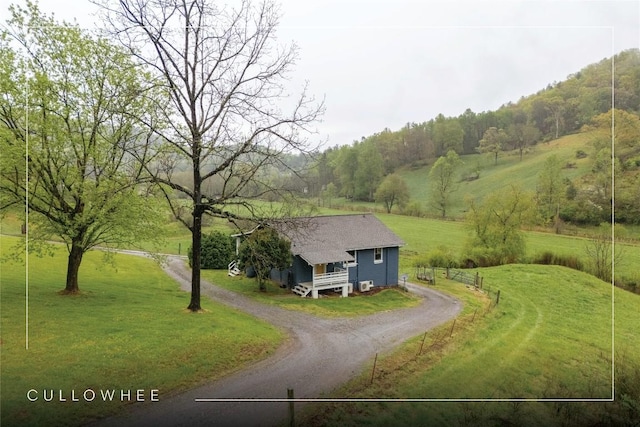 birds eye view of property featuring a rural view