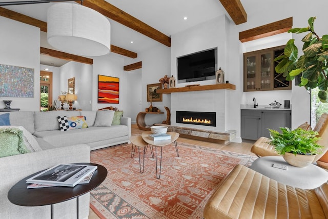 1240 King Gap Rd, Highlands, NC 28741 - living area featuring beamed ceiling, wood finished floors, a warm lit fireplace, recessed lighting, and bar