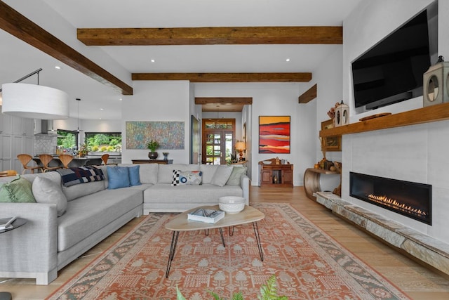 1240 King Gap Rd, Highlands, NC 28741 - living area featuring beam ceiling, light wood-type flooring, a glass covered fireplace, and recessed lighting