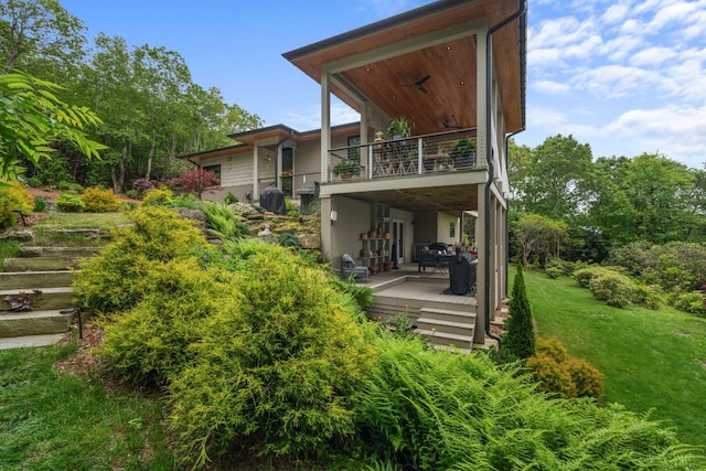 1240 King Gap Rd, Highlands, NC 28741 - rear view of house with a balcony and a lawn