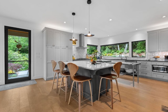 1240 King Gap Rd, Highlands, NC 28741 - kitchen with ventilation hood, gray cabinets, appliances with stainless steel finishes, backsplash, and recessed lighting