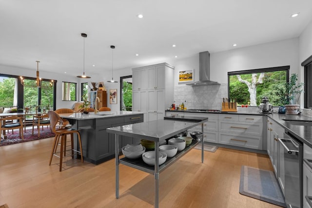 1240 King Gap Rd, Highlands, NC 28741 - kitchen with wall chimney exhaust hood, gray cabinets, light wood-type flooring, stainless steel dishwasher, and recessed lighting