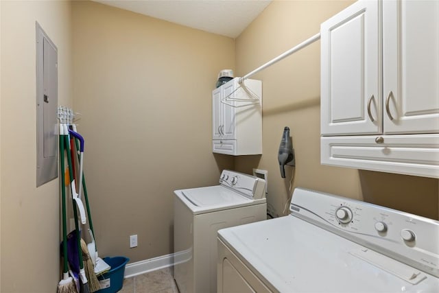 151 Rhododendron Ct, Sapphire, NC 28774 - laundry room with washing machine and dryer, cabinet space, light tile patterned flooring, and electric panel
