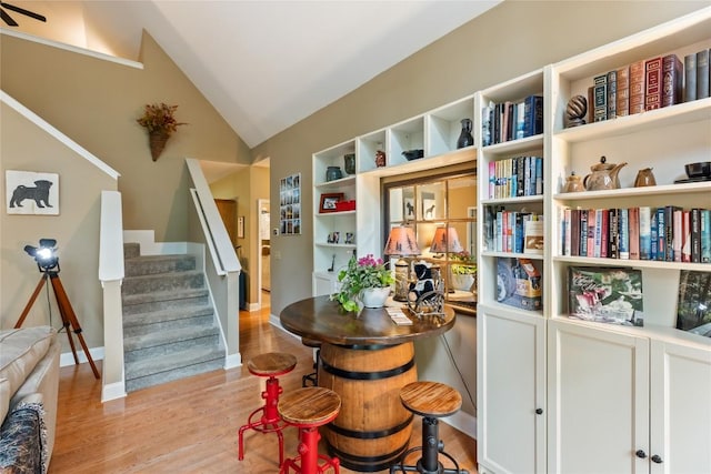 151 Rhododendron Ct, Sapphire, NC 28774 - dining room with wood finished floors, lofted ceiling, and stairs