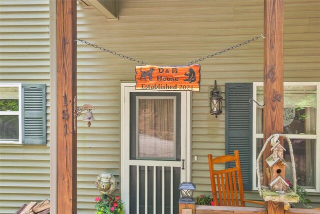 151 Rhododendron Ct, Sapphire, NC 28774 - view of exterior entry featuring covered porch