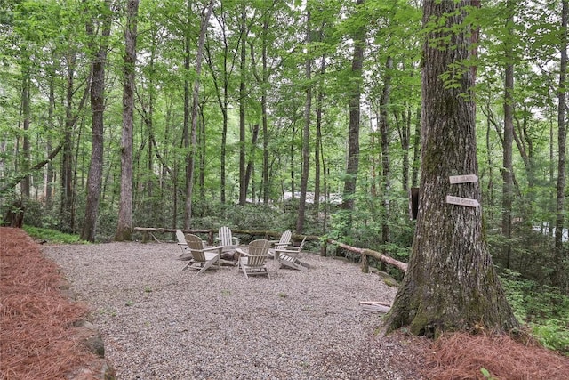 151 Rhododendron Ct, Sapphire, NC 28774 - view of yard featuring an outdoor fire pit and a view of trees