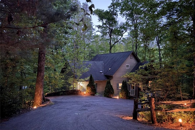 151 Rhododendron Ct, Sapphire, NC 28774 - view of front of property featuring asphalt driveway, roof with shingles, and a forest view