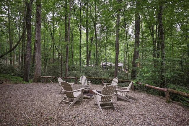 151 Rhododendron Ct, Sapphire, NC 28774 - view of patio with a fire pit and a wooded view