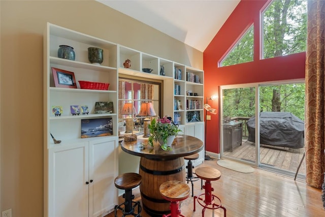 151 Rhododendron Ct, Sapphire, NC 28774 - dining space with wood finished floors and high vaulted ceiling