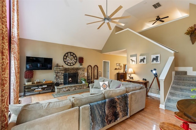 151 Rhododendron Ct, Sapphire, NC 28774 - living room with a ceiling fan, light wood-style floors, stairway, high vaulted ceiling, and a fireplace