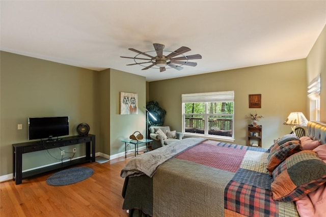 151 Rhododendron Ct, Sapphire, NC 28774 - bedroom featuring wood finished floors and a ceiling fan