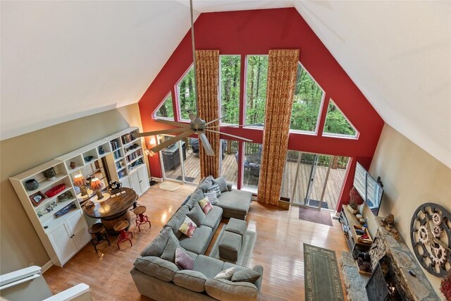151 Rhododendron Ct, Sapphire, NC 28774 - living area featuring wood finished floors and high vaulted ceiling