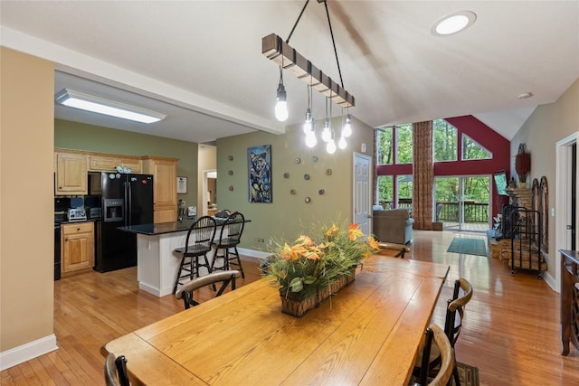 151 Rhododendron Ct, Sapphire, NC 28774 - dining space with light wood-style floors and vaulted ceiling