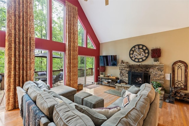 151 Rhododendron Ct, Sapphire, NC 28774 - living area featuring high vaulted ceiling, wood finished floors, a stone fireplace, and ceiling fan