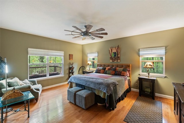 151 Rhododendron Ct, Sapphire, NC 28774 - bedroom with light wood-style floors and ceiling fan