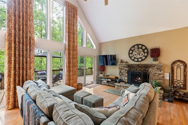 151 Rhododendron Ct, Sapphire, NC 28774 - living room with high vaulted ceiling, wood finished floors, a fireplace, and ceiling fan