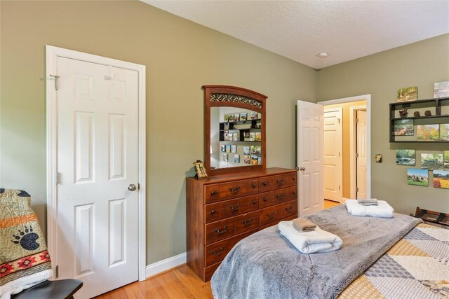 151 Rhododendron Ct, Sapphire, NC 28774 - bedroom featuring light wood-style floors and baseboards