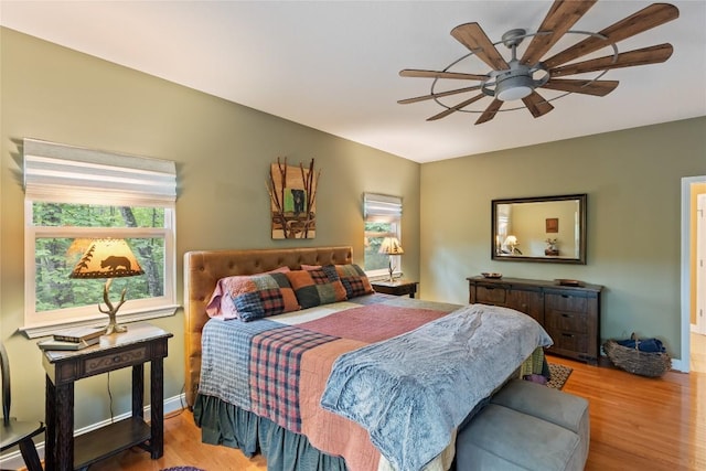 151 Rhododendron Ct, Sapphire, NC 28774 - bedroom featuring wood finished floors and ceiling fan