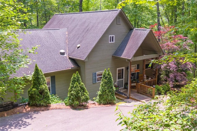151 Rhododendron Ct, Sapphire, NC 28774 - rustic home featuring a porch and a shingled roof