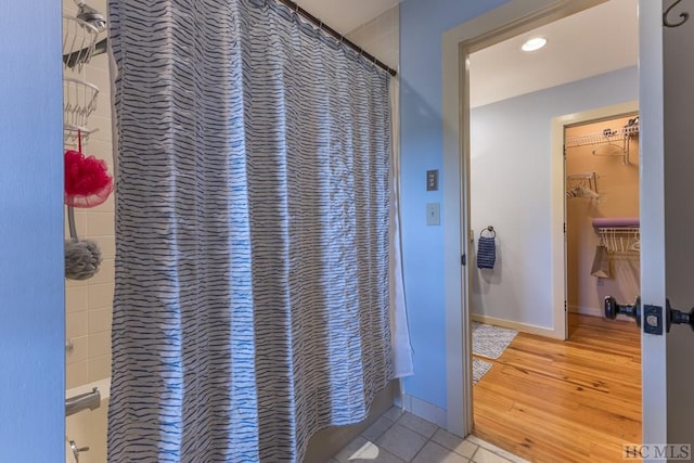 bathroom featuring hardwood / wood-style flooring and curtained shower