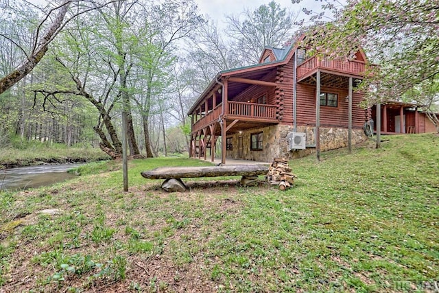 exterior space featuring a deck and ac unit