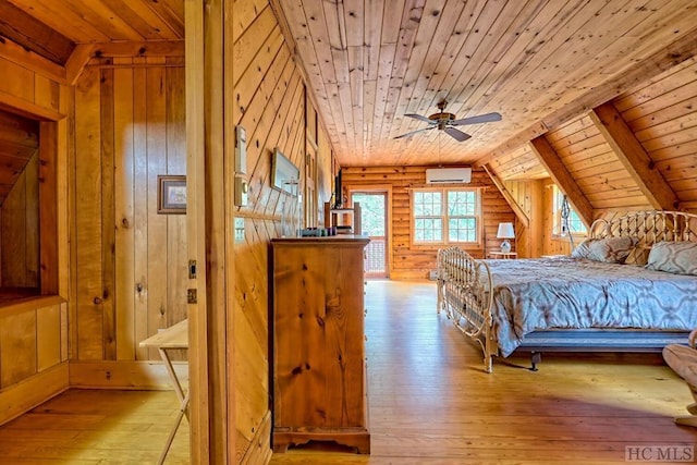 bedroom with a wall mounted AC, light hardwood / wood-style flooring, log walls, and wood ceiling