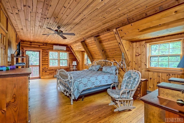 bedroom featuring light hardwood / wood-style flooring, wooden ceiling, an AC wall unit, wooden walls, and rustic walls